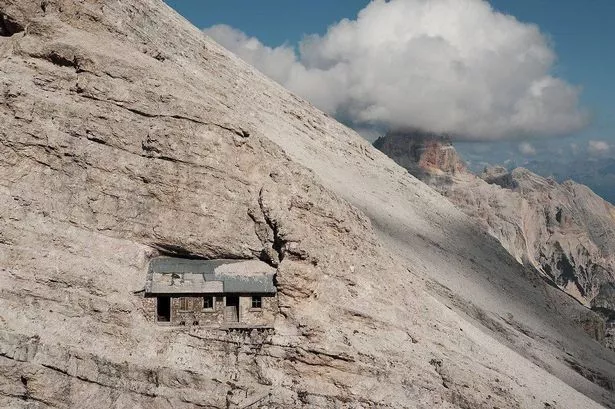 Mystery of 'world's loneliest house' that's stuck on side of remote  mountain range - Daily Star