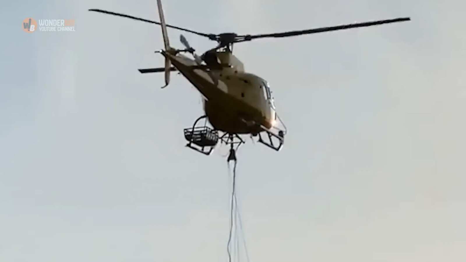 Helicopter lowering rope to Susie